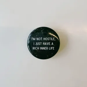 I'm Not Hostile I Just Have a Rich Inner Life 1.5" Button in Black and Tan